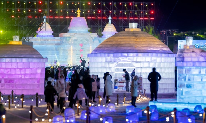 Tourists visit an ice and snow festival at the Daheihe military cultural park in Hohhot, north China's Inner Mongolia Autonomous Region, Dec. 31, 2025. The event kicked off on Wednesday, attracting tourists to enjoy lanterns, ice sculptures and snacks. (Xinhua/Lian Zhen)
