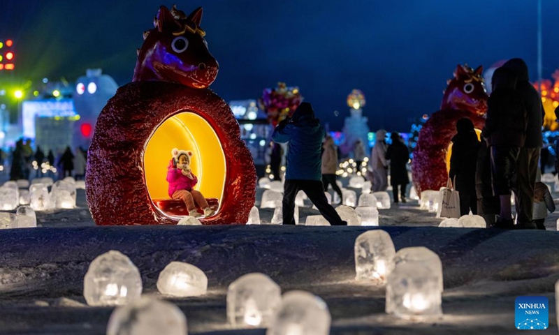 Tourists visit an ice and snow festival at the Daheihe military cultural park in Hohhot, north China's Inner Mongolia Autonomous Region, Dec. 31, 2025. The event kicked off on Wednesday, attracting tourists to enjoy lanterns, ice sculptures and snacks. (Xinhua/Lian Zhen)