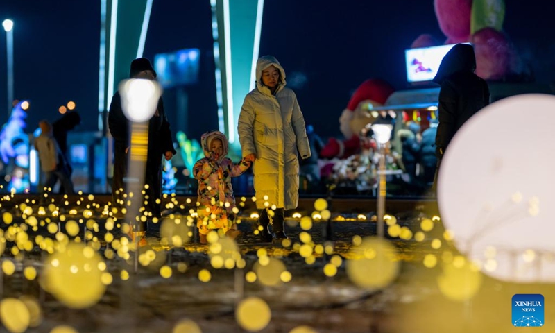 Tourists visit an ice and snow festival at the Daheihe military cultural park in Hohhot, north China's Inner Mongolia Autonomous Region, Dec. 31, 2025. The event kicked off on Wednesday, attracting tourists to enjoy lanterns, ice sculptures and snacks. (Xinhua/Lian Zhen)