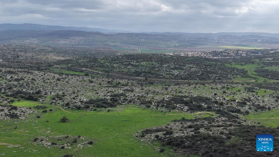 An aerial view shows the Israeli city of Modiin and the surrounding green fields on Jan. 2, 2026. (Photo by Gil Cohen Magen/Xinhua)