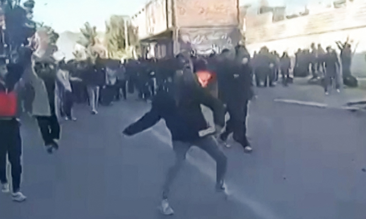 This grab taken on January 2, 2026, from UGC images posted on social media shows protestors attacking a building in Fasa, in southern Iran on December 31. Photo: VCG