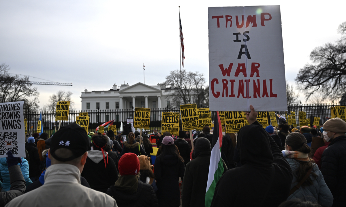 People carrying banners gather to protest the US attacks on Venezuela, in Washington DC, United States on January 3, 2026. Photo: VCG