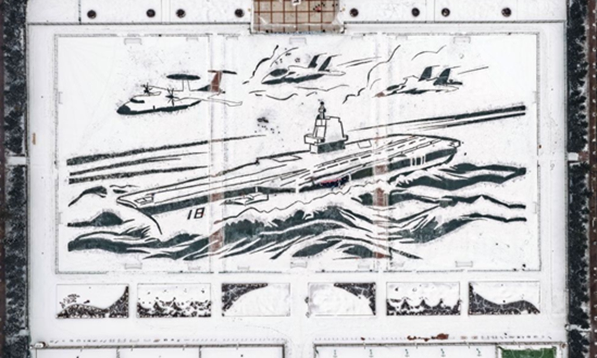 The 2025 snowfield artwork depicting China's aircraft carrier Fujian, flanked by three carrier-based aircrafts, is completed by Harbin Engineering University students and faculty members on December 28 2025. Photo: People's Daily