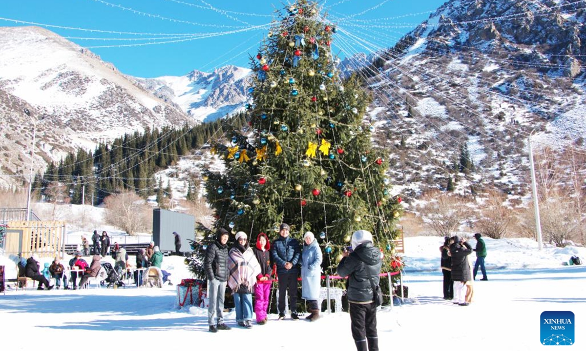 Tourists take photos in the Ala-Archa National Park, some 30 kilometers away from Bishkek, Kyrgyzstan, Jan. 2, 2026. (Photo by Liu Xiaowan/Xinhua)