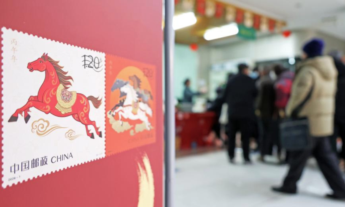 People buy special stamps marking the Year of the Horse in Lianyungang, east China's Jiangsu Province, Jan. 5, 2026. China Post on Monday unveiled a set of two special stamps to celebrate the upcoming Chinese zodiac Year of the Horse. (Photo by Geng Yuhe/Xinhua)