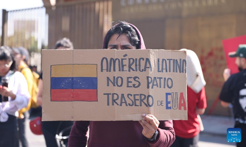 People protest with a placard reading Latin America is not the backyard of the United States outside the U.S. Embassy in Mexico City, capital of Mexico, on Jan. 3, 2026. (Photo: Xinhua)