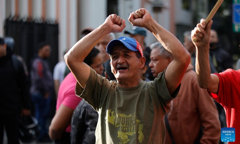 A person demonstrates near the Miraflores Palace in Caracas, the capital of Venezuela, on Jan. 3, 2026. The U.S. military launched a series of attacks against Venezuela early Saturday morning, reportedly capturing President Nicolas Maduro and flying him out of the country. (Photo: Xinhua)