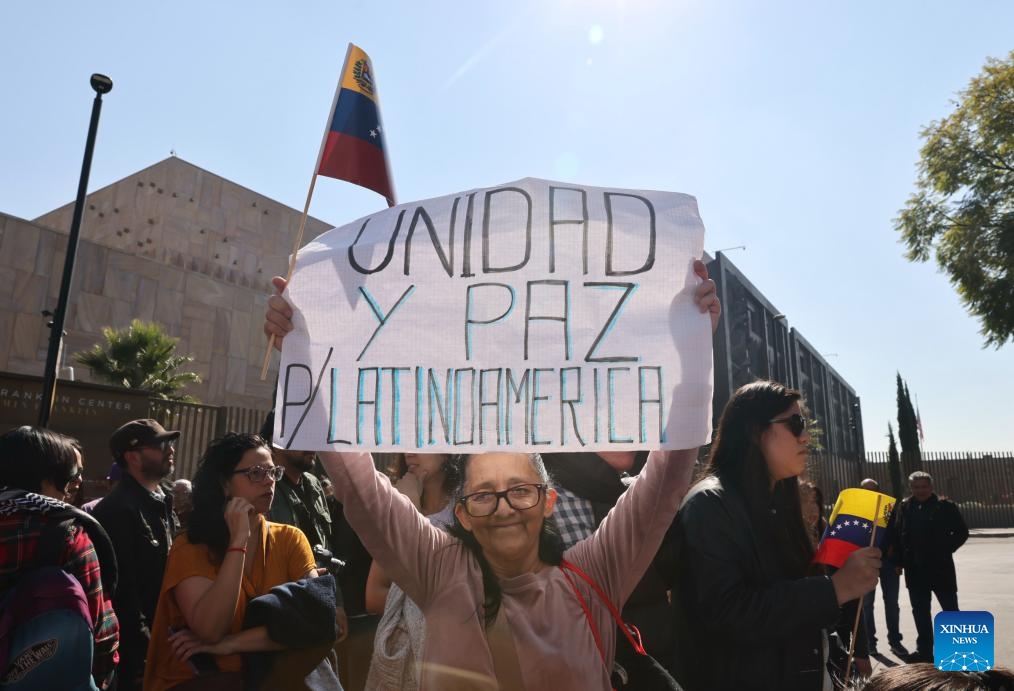 People protest with a placard reading Unity and peace in Latin America outside the U.S. Embassy in Mexico City, capital of Mexico, on Jan. 3, 2026. (Photo: Xinhua)