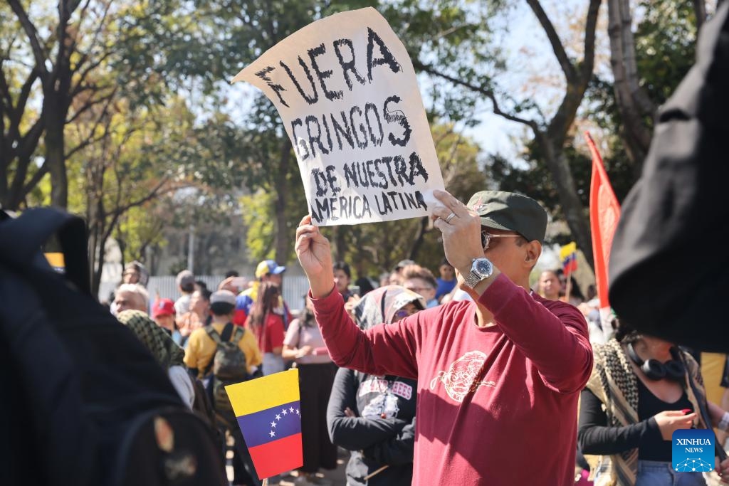 People protest with a placard reading Get Americans out of our Latin America outside the U.S. Embassy in Mexico City, capital of Mexico, on Jan. 3, 2026. (Photo: Xinhua)