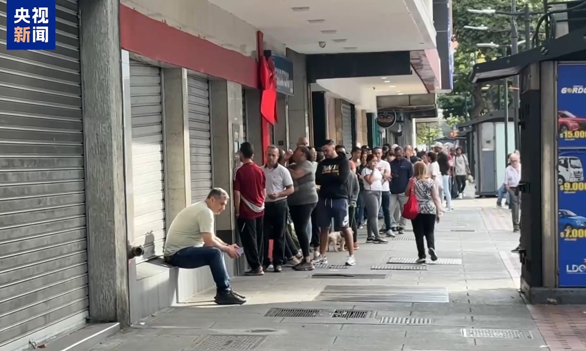 Photo: a screenshot CCTV News video showing local residents in Caracas, the capital of Venezuela, line up outside a store on January 3, 2026. 