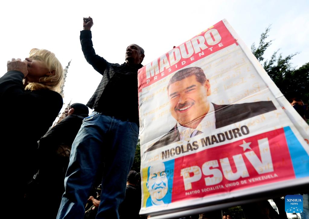 People demonstrate near the Miraflores Palace in Caracas, the capital of Venezuela, on Jan. 3, 2026. The U.S. military launched a series of attacks against Venezuela early Saturday morning, reportedly capturing President Nicolas Maduro and flying him out of the country. (Photo: Xinhua)