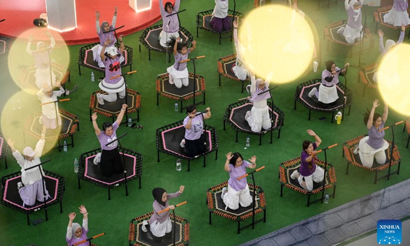 People participate in trampoline exercise at a mall in Tangerang, Banten province, Indonesia, Jan. 3, 2026. (Photo: Xinhua)