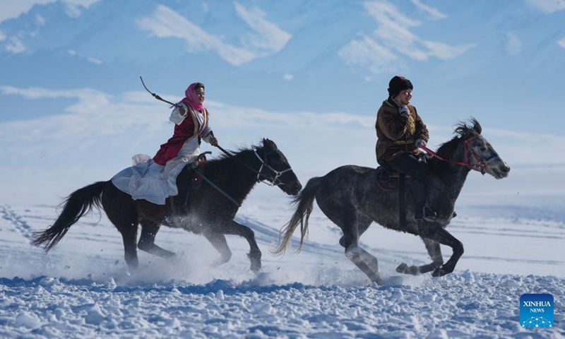 Herders perform for tourists at a wetland park in Zhaosu County, Ili Kazak Autonomous Prefecture, northwest China's Xinjiang Uygur Autonomous Region, Jan. 3, 2026. Leveraging its unique ice and snow resources in winter, Zhaosu County has developed diverse winter tourist services to attract visitors. (Photo: Xinhua)