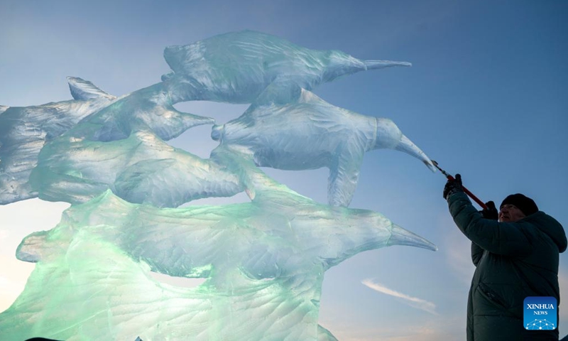A competitor works on an ice sculpture during the 37th China Harbin International Ice Sculpture Competition at the Harbin Ice-Snow World in Harbin, northeast China's Heilongjiang Province, Jan. 3, 2026. The competition kicked off here on Friday. (Photo: Xinhua)
