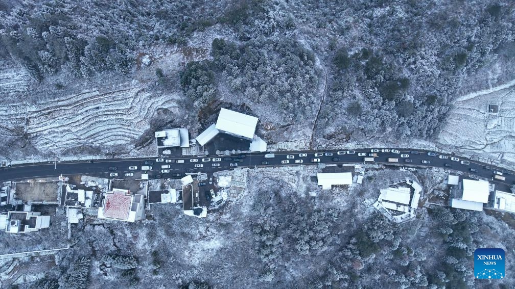 An aerial drone photo taken on Jan. 2, 2026 shows the snowy scenery in Youyang Tujia and Miao Autonomous County, southwest China's Chongqing Municipality. Snowfall hit many parts of China during the New Year's Day holiday, drawing tourists to enjoy the snowy scenery. (Photo: Xinhua)