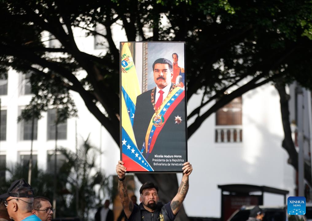 A person demonstrates near the Miraflores Palace in Caracas, the capital of Venezuela, on Jan. 3, 2026. The U.S. military launched a series of attacks against Venezuela early Saturday morning, reportedly capturing President Nicolas Maduro and flying him out of the country. (Photo: Xinhua)