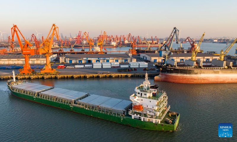 A drone photo taken on Jan. 2, 2026 shows a cargo ship departing from a terminal of a subsidiary of Tianjin Port Holdings Co., Ltd. at Tianjin Port in north China's Tianjin. Tianjin Port has witnessed a bustling scene during this New Year's Day holiday, with a steady stream of vessels docking and unloading containers here, marking a fresh start of the new year. (Photo: Xinhua)