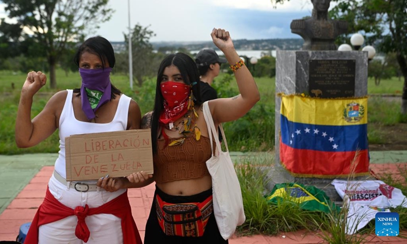 People in support of Venezuela hold a placard outside the Venezuelan Embassy in Brasilia, Brazil, on Jan. 3, 2026. The U.S. military launched a series of attacks against Venezuela early Saturday morning, reportedly capturing Venezuelan President Nicolas Maduro and flying him out of the country. (Photo: Xinhua)
