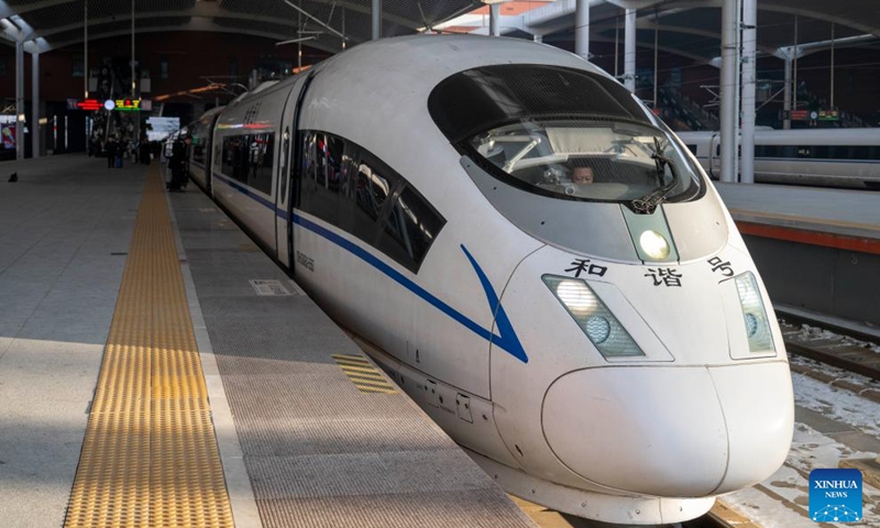 The bullet train No.G1276, the first themed high-speed train of the Harbin Ice-Snow World, is pictured at Harbin West Station in Harbin, northeast China's Heilongjiang Province, Jan. 4, 2026. The first high-speed train with the theme of the Harbin Ice-Snow World began service from Harbin West Station on Sunday, heading for Wuhan City in central China's Hubei Province. Featuring unique interior and exterior decorations of the Harbin Ice-Snow World, the themed high-speed train serves as a mobile emblem to boost the ice and snow economy. (Photo: Xinhua)