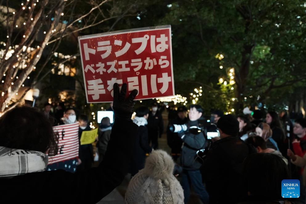People hold slogans in support of Venezuela during a protest in front of the U.S. embassy in Tokyo, Japan, Jan. 6, 2026. The U.S. military struck Venezuela on Saturday, capturing President Maduro and his wife and transferring them to the United States. (Xinhua/Jia Haocheng)