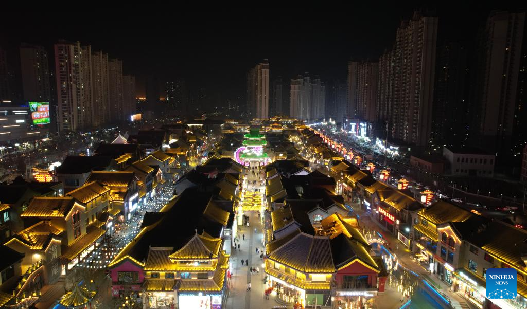 An aerial drone photo taken on Jan. 6, 2026 shows a night view of Qilihe District of Lanzhou, northwest China's Gansu Province. At the beginning of the new year, Lanzhou has been actively creating a festive atmosphere and promoting the upgrading of mature business districts and characteristic streets in the urban area. A series of new products and services has been launched to boost the consumption. (Xinhua/Chen Bin)
