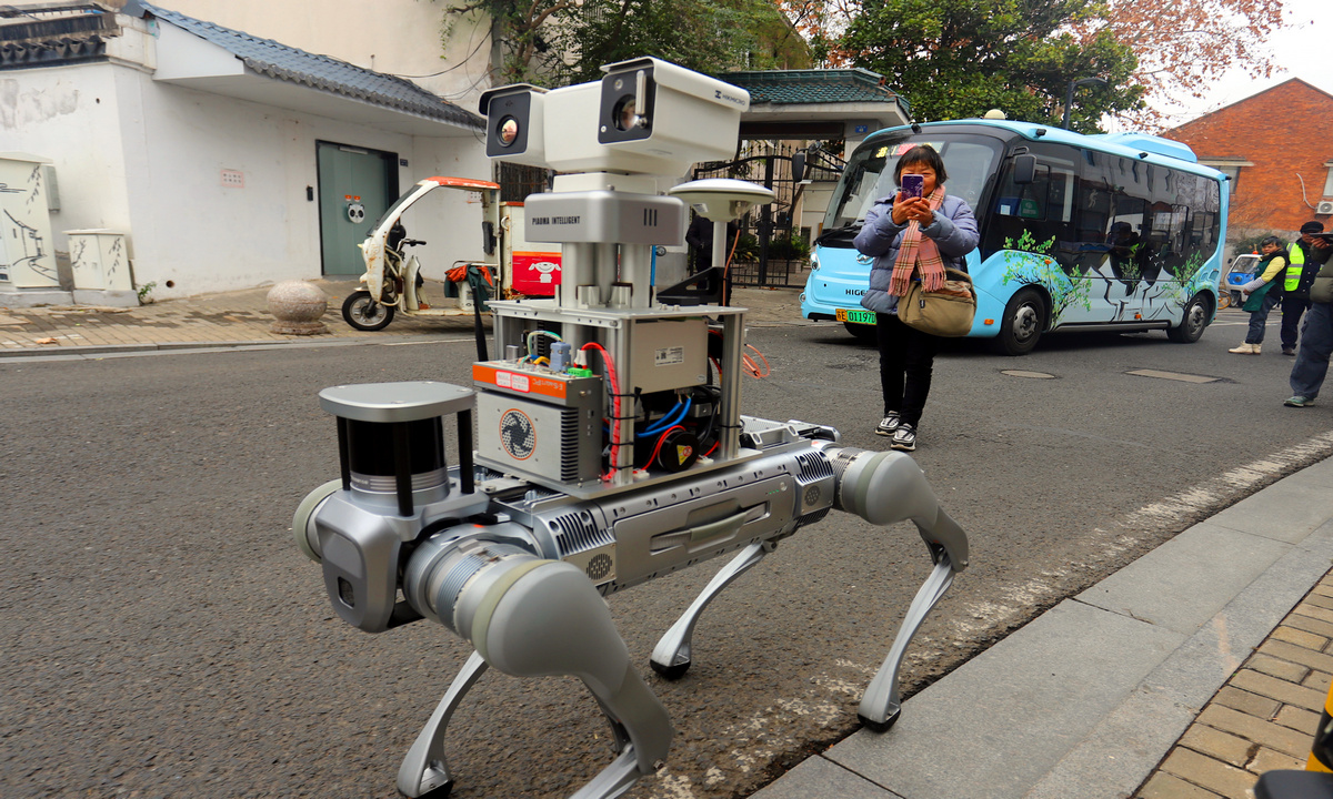 A four-legged power grid patrol robot dog walks along Huanti Road in Gusu District, Suzhou, East China's Jiangsu Province, on January 6, 2026. Its futuristic design drew crowds and gave the street a splash of 
