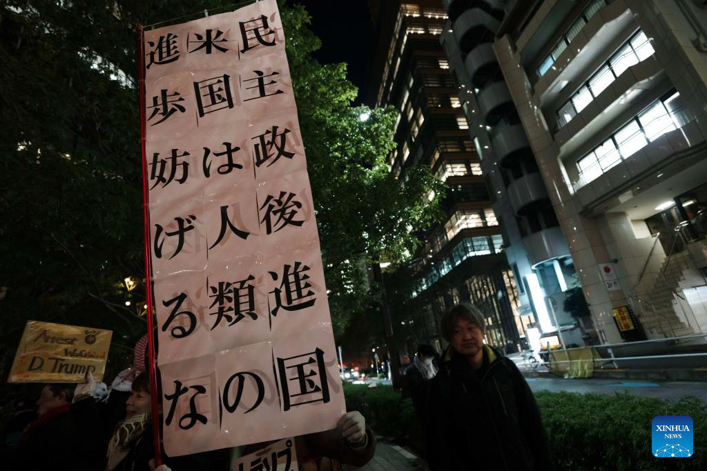 People hold a slogan in support of Venezuela during a protest in front of the U.S. embassy in Tokyo, Japan, Jan. 6, 2026. The U.S. military struck Venezuela on Saturday, capturing President Maduro and his wife and transferring them to the United States. (Xinhua/Jia Haocheng)