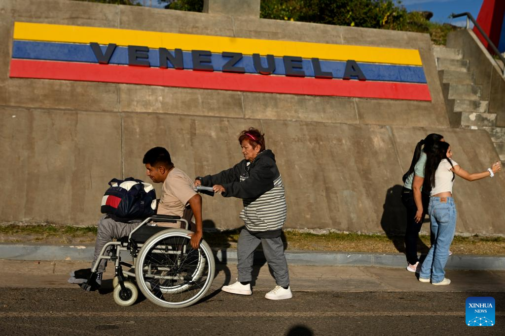 In this photo taken in Pacaraima, Roraima, Brazil, people are seen near the border between Brazil and Venezuela, Jan. 7, 2026. (Photo by Lucio Tavora/Xinhua)