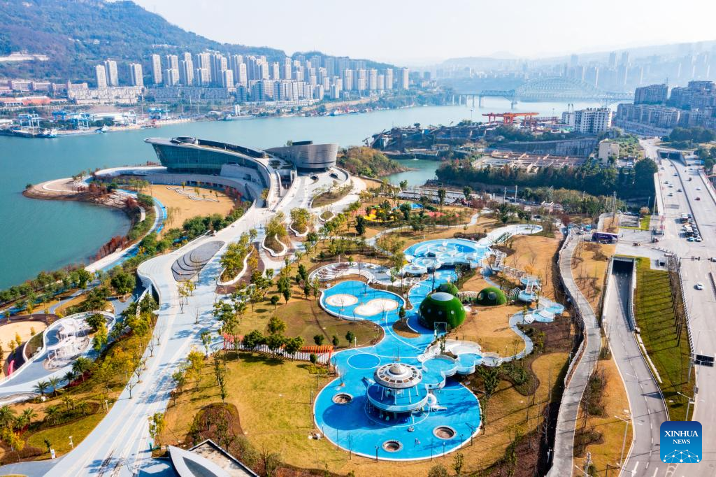 An aerial drone photo taken on Dec. 25, 2025 shows a view of a riverbank park in Chongqing, southwest China. Acting as a crucial ecological gateway for the upper reaches of the Yangtze River, Chongqing has intensified its environmental protection efforts in recent years.
The city has effectively conserved areas along its riverbanks, enhancing their function as protective green corridors. Leveraging these environmental improvements, the city has developed new cultural tourism attractions and landmarks.
This integration of ecological conservation and tourism development has promoted local tourism, contributing to improved resident wellbeing and quality of life. (Photo by Huang Jianhua/Xinhua)