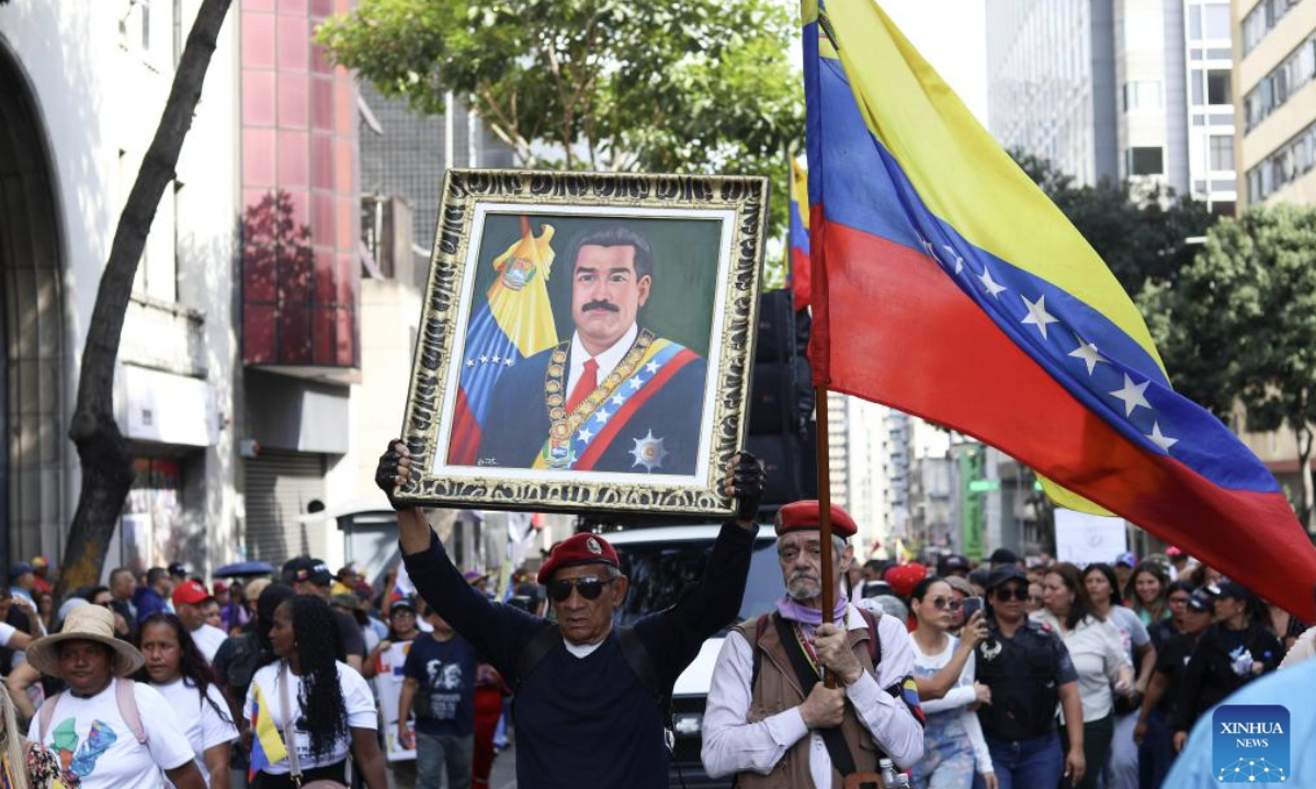 People attend a rally in support of President Nicolas Maduro in Caracas, Venezuela, Jan. 6, 2026. (Str/Xinhua)