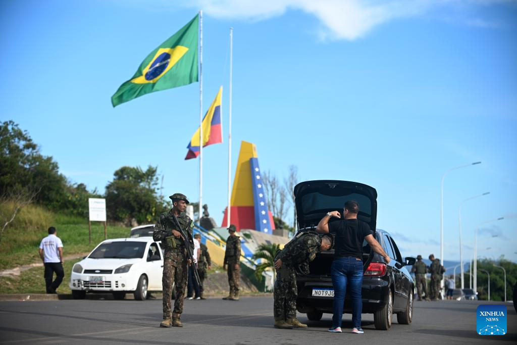 Brazilian army soldiers inspect a vehicle near the border between Brazil and Venezuela in Pacaraima, Roraima, Brazil, Jan. 7, 2026. (Photo by Lucio Tavora/Xinhua)