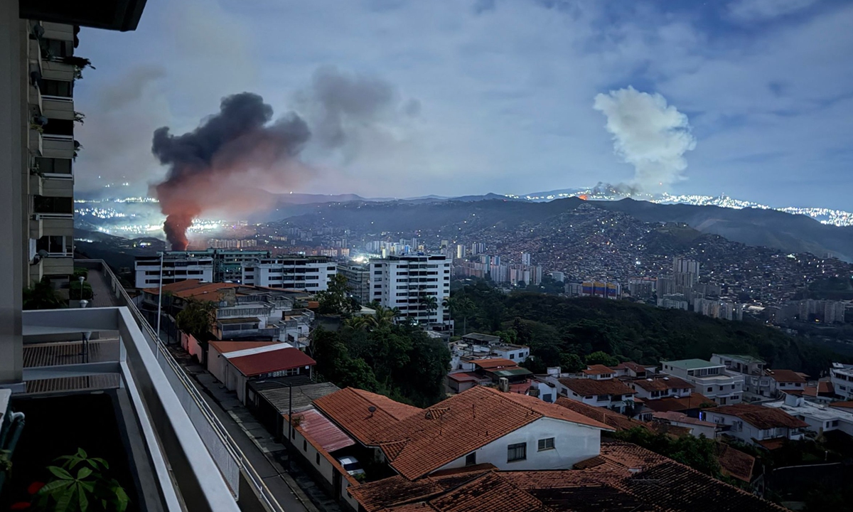 Smoke billows over Caracas on January 3, 2026, after a series of explosions, which are part of a US military operation that led to the forcible seizure of Venezuelan President Nicolas Madruo. Photo: VCG