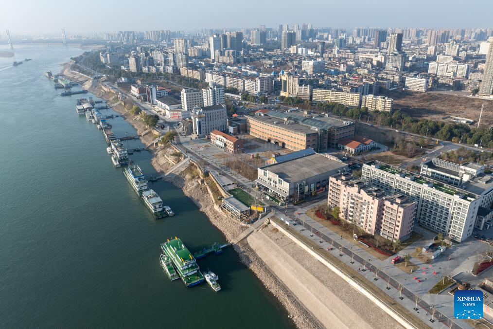 An aerial drone photo taken on Jan. 7, 2026 shows a view of the cultural and creative park at Shashi dock in Jingzhou, central China's Hubei Province. In recent years, Jingzhou has continuously conducted the restoration and green development of historic sites. Leveraging the profound history and industrial heritage, Shashi dock here has been transformed into a cultural and creative park integrating cultural exhibitions, riverside tourism, exercise facilities, and innovation bases, which has become a popular leisure destination for citizens. (Xinhua/Du Zixuan)