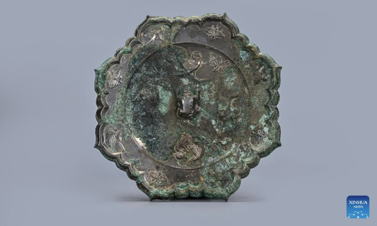 This undated file photo shows a bronze mirror unearthed from the tomb of Ma Sanniang, wife of Dong Shunxian, a military officer in the Tang Dynasty (618-907), in Xi'an, northwest China's Shaanxi Province.(Shaanxi Academy of Archaeology/Handout via Xinhua)