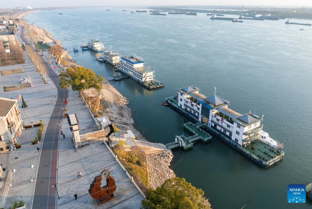 An aerial drone photo taken on Jan. 7, 2026 shows a view of the cultural and creative park at Shashi dock in Jingzhou, central China's Hubei Province. In recent years, Jingzhou has continuously conducted the restoration and green development of historic sites. Leveraging the profound history and industrial heritage, Shashi dock here has been transformed into a cultural and creative park integrating cultural exhibitions, riverside tourism, exercise facilities, and innovation bases, which has become a popular leisure destination for citizens. (Xinhua/Du Zixuan)