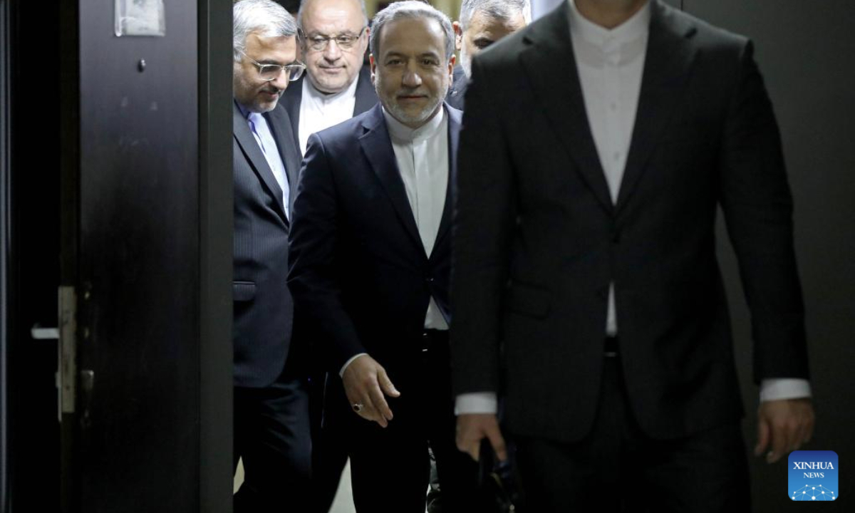 The photo taken on Jan. 8, 2026 shows Iranian Foreign Minister Araghchi (C) entering a room to meet with Lebanese Economy and Trade Minister Amer Bisat in Beirut. (Photo by Bilal Jawich/Xinhua)
