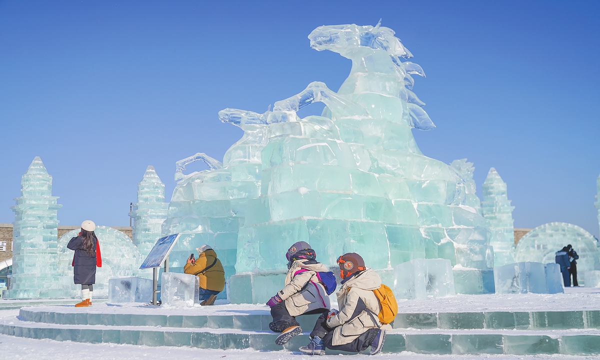 Tourists take photos with an ice sculpture of a horse at Harbin Ice and Snow World, seeking good fortune ahead of the upcoming Year of the Horse in Harbin, Northeast China's Heilongjiang Province, on January 5, 2026. According to Xinhua, during the 2024-2025 ice and snow season, Heilongjiang received 135 million tourist visits, a year-on-year increase of 18.5 percent, generating tourism revenue of 211.72 billion yuan ($29.7 billion), which rose by 30.7 percent. Photo: VCG