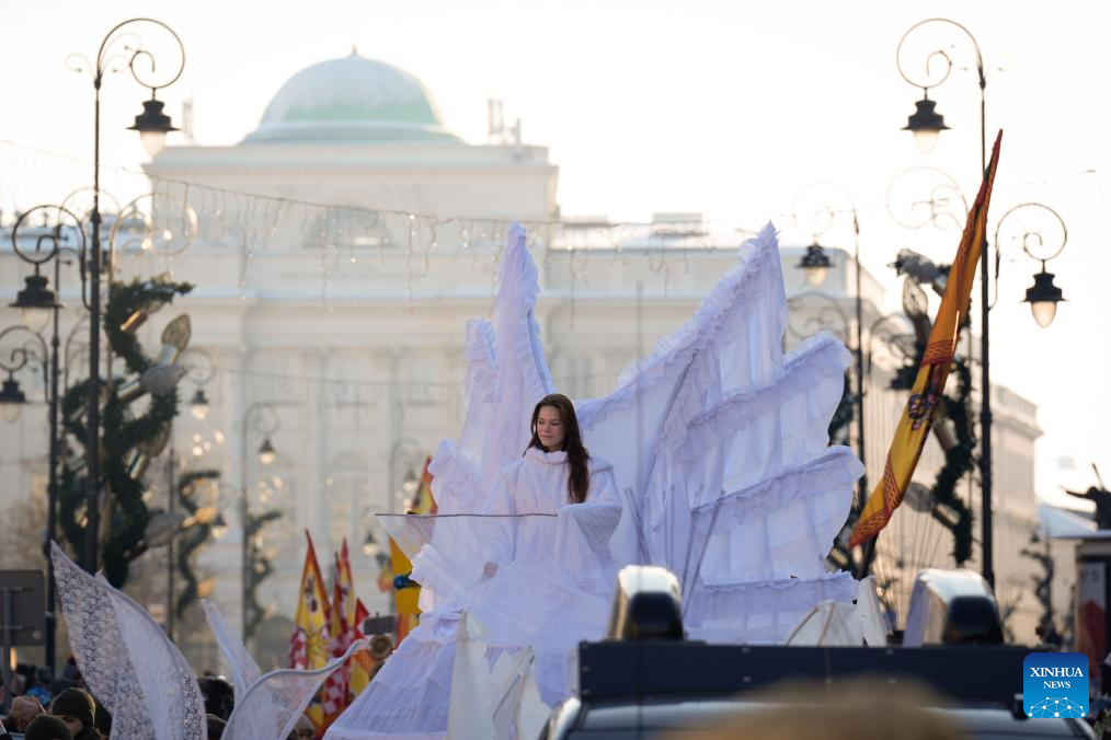An actress portraying an angel attends the Epiphany procession in Warsaw, Poland, Jan. 6, 2026. (Photo by Jaap Arriens/Xinhua)