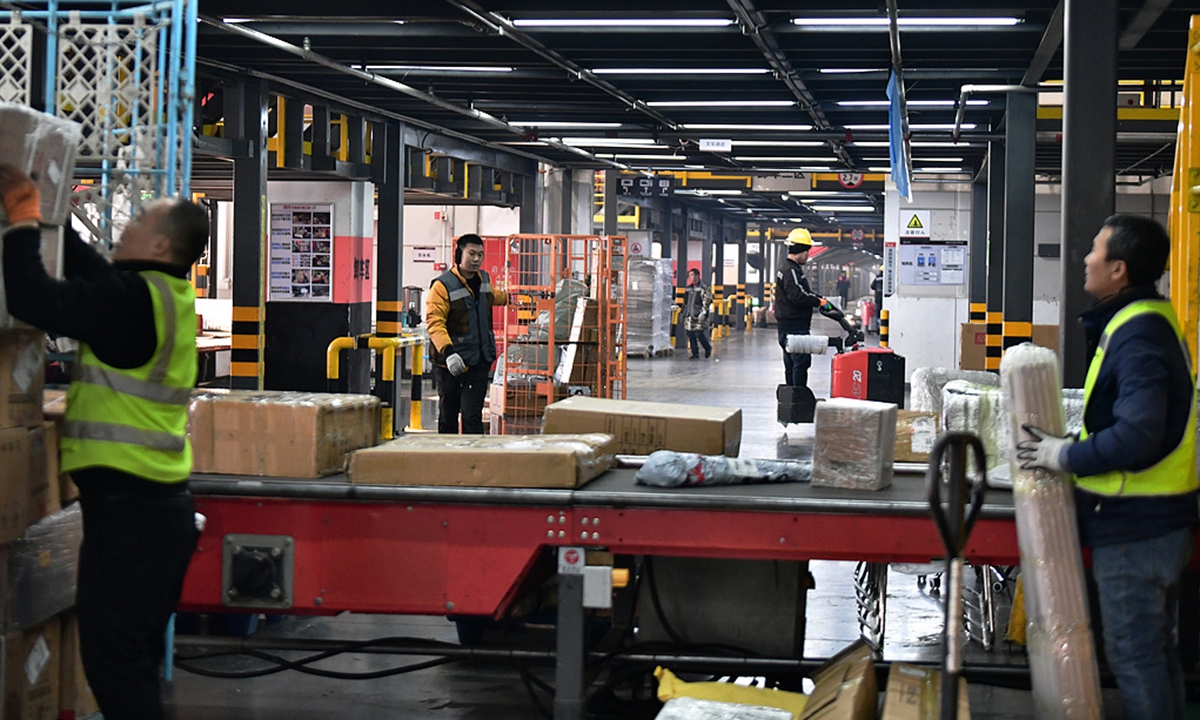 Workers are on duty at an express delivery sorting and transfer center in the development zone of Langfang, North China's Hebei Province, on December 17, 2025. The city's annual express delivery volume last year has recently surpassed 2 billion parcels for the first time, with more than 6 million packages dispatched on average each day to destinations across China and overseas. Photo: VCG