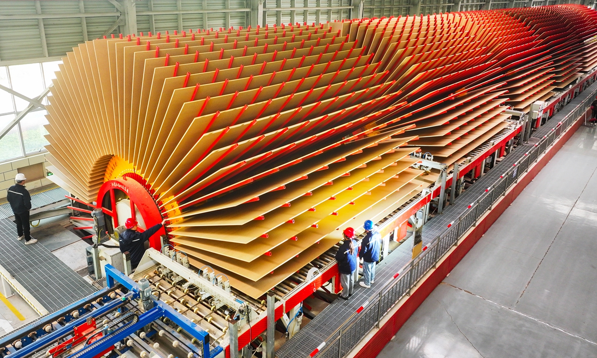 Workers are busy on the production lines at a wood factory in Yongzhou, Central China's Hunan Province on January 7, 2026. As the new year begins, local factories like this one are running at full capacity to fill orders, aiming to secure a robust start for the year. Photo: VCG
