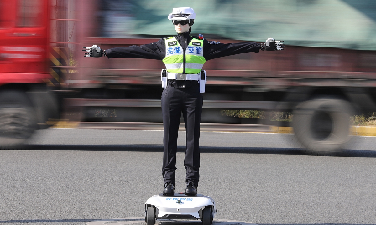 An eye-catching new traffic officer directs traffic at an intersection in the Jiujiang district, Wuhu, Anhui Province on January 8, 2026, on the eve of the sixth