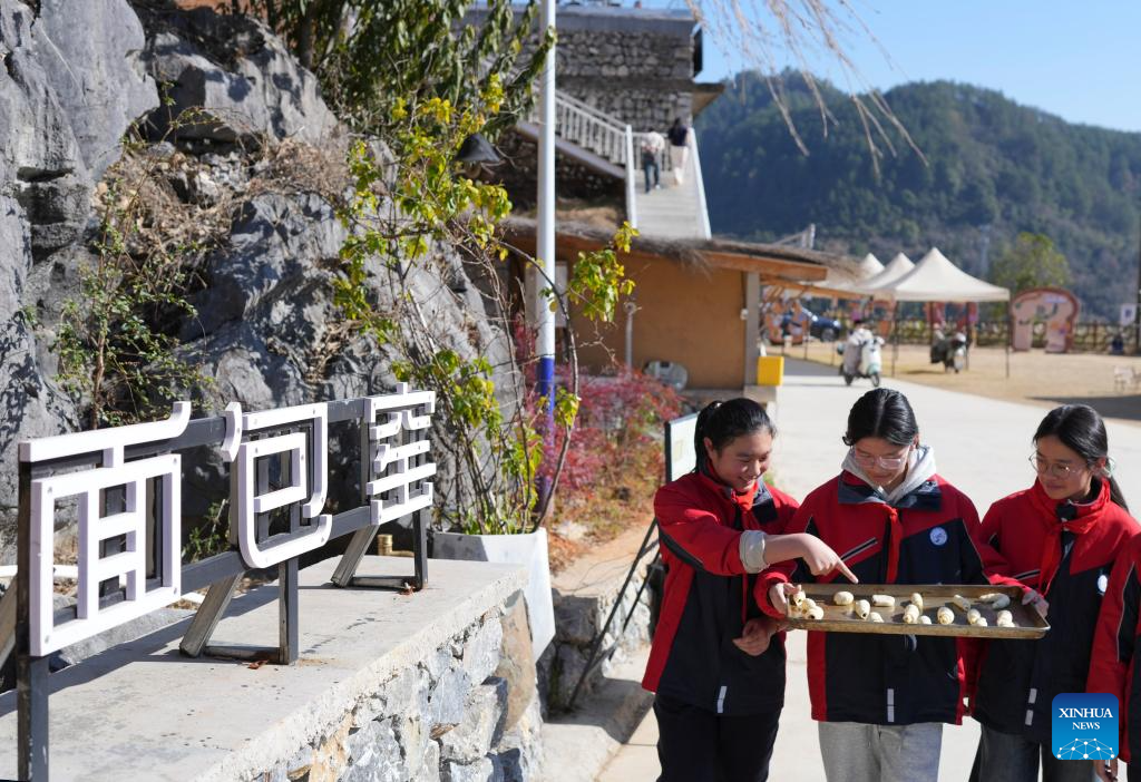 Students attend a bread-making event during a study tour in Lulikeng Village of Changshan County, east China's Zhejiang Province, Jan. 14, 2026. Lulikeng Village has renovated its abandoned lime kilns into rural tourism facilities in recent years, turning the village into a destination for tourists from surrounding areas. Since 2024, various business sectors in the village have enabled over 150 villagers to find jobs right at their doorstep, and increased the village's income by more than 6 million yuan (about 0.86 million U.S. dollars). (Xinhua/Weng Xinyang)