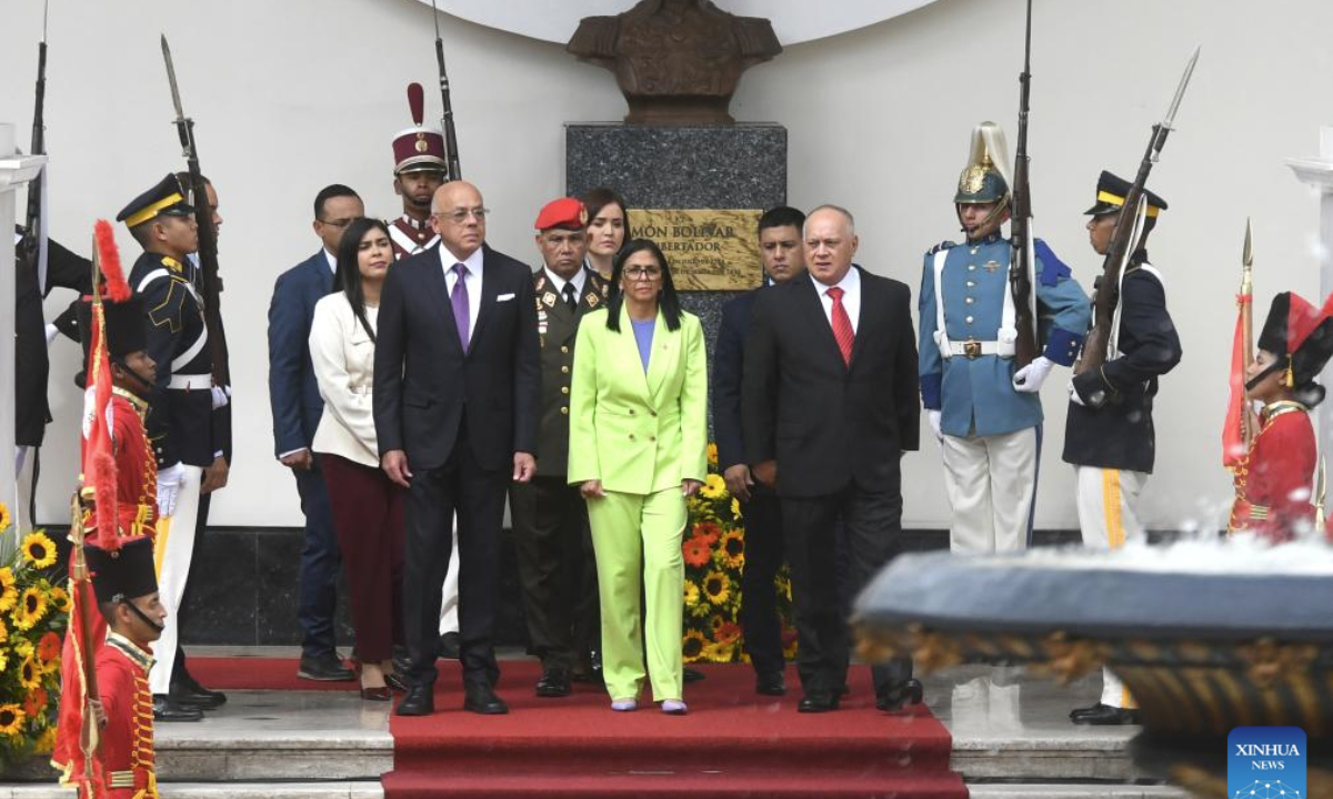 Venezuelan acting president Delcy Rodriguez (C) walks ahead of her annual report to the legislature on behalf of the administrative body in Caracas, Venezuela, Jan. 15, 2026. (Photo by Marco Salgado/Xinhua)