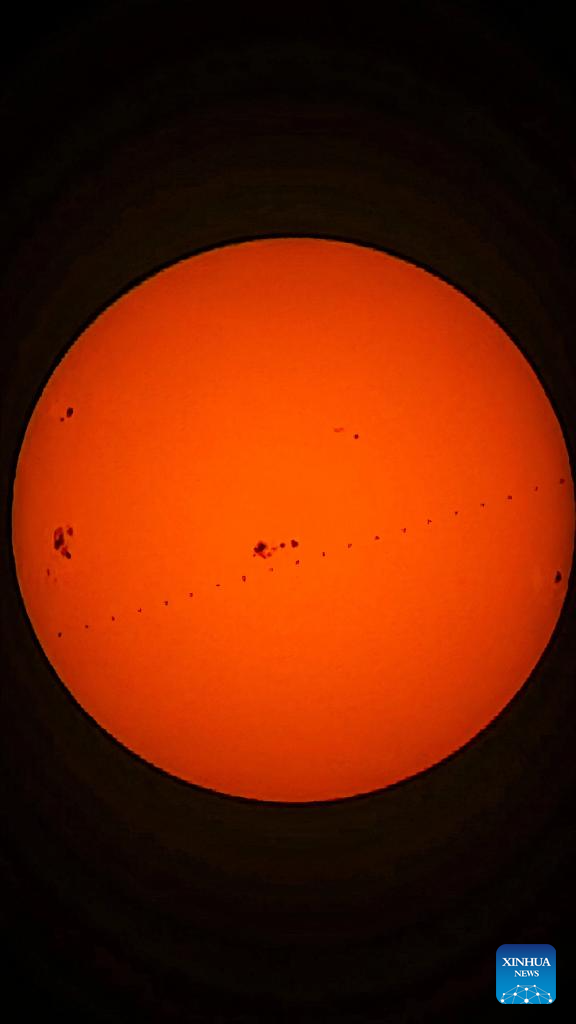A stacked composite photo taken on Jan. 16, 2026 in China's capital Beijing shows the Chinese space station passing in front of the Sun. (Photo by Zhong Yi/Xinhua)