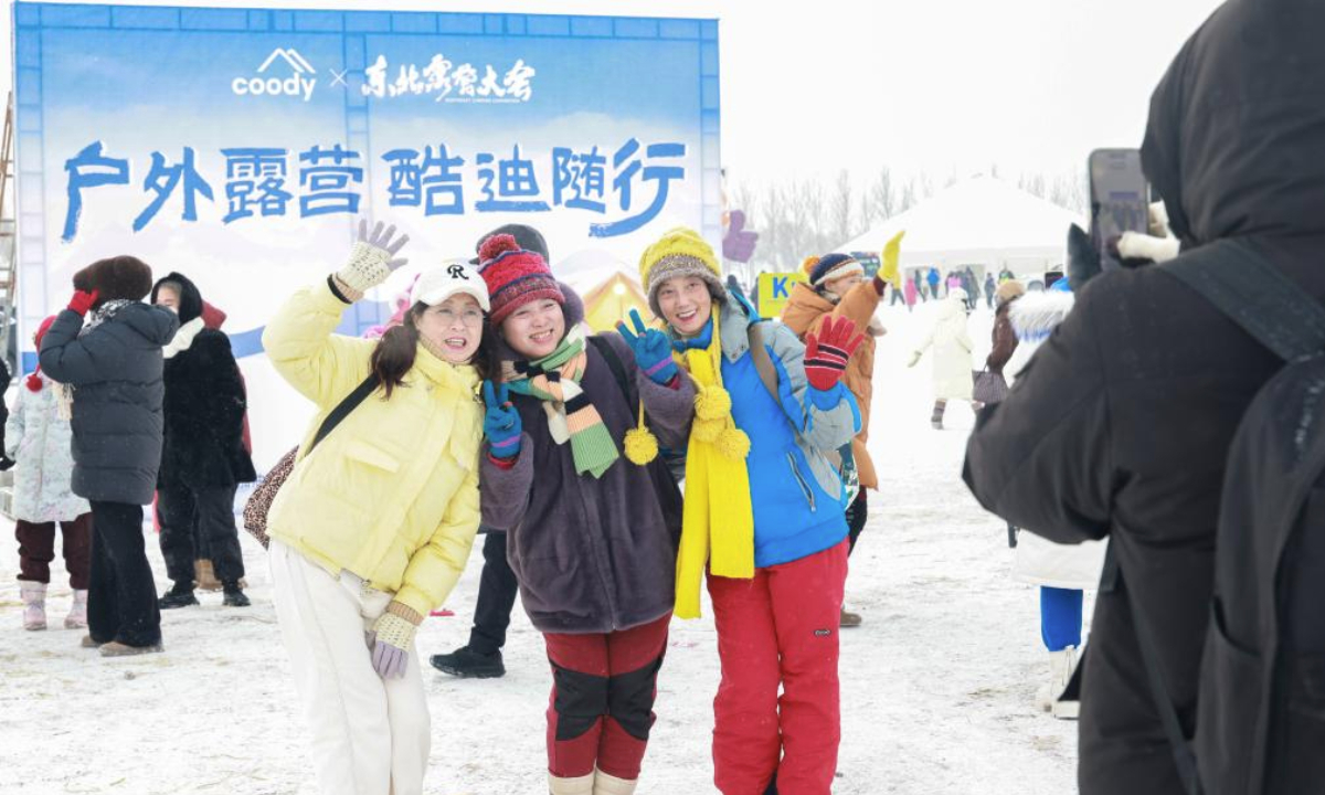 Tourists pose for photos at a camping festival in Qiqihar City, northeast China's Heilongjiang Province, on Jan. 12, 2026. The week-long camping festival opened here on Monday, where camping enthusiasts and tourists across China are allowed to experience the unique charm of camping and local folk customs in frigid chilliness. (Photo by Xu Shuai/Xinhua)