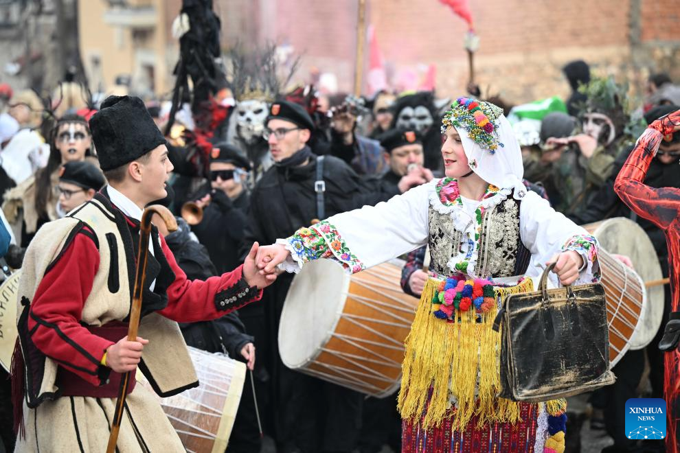 Revelers participate in a carnival celebration in the village of Vevcani, North Macedonia, Jan. 13, 2026. (Photo by Tomislav Georgiev/Xinhua)