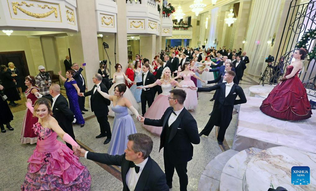 People dressed in festive costumes attend a ball in Minsk, capital of Belarus on Jan. 13, 2026. A ball was held here to welcome the upcoming old calendar New Year. (Photo by Henadz Zhinkov/Xinhua)