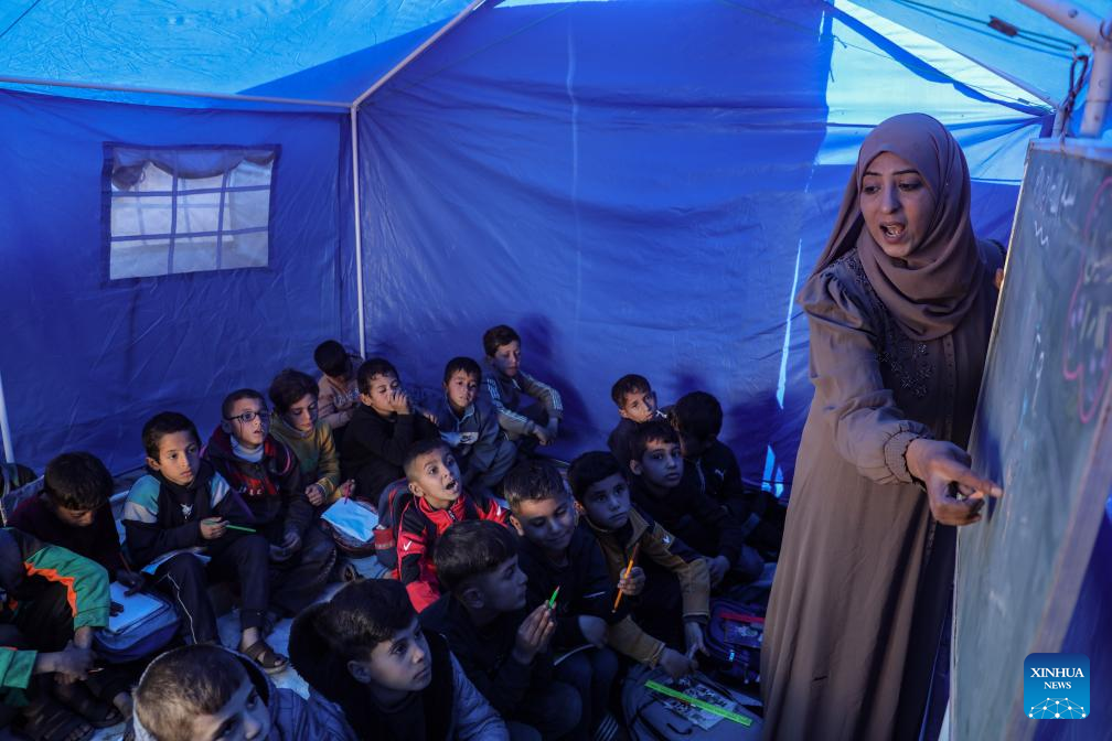 Students attend a class at Al-Shamal Educational School, located just 100 meters from the Yellow Line in Jabalia Refugee Camp, northern Gaza Strip, Jan. 12, 2026. (Photo by Rizek Abdeljawad/Xinhua)