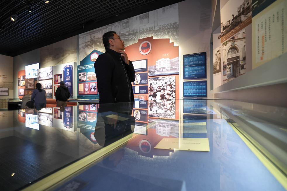 People visit an exhibition featuring modern Tianjin's industry and commerce at the Tianjin Museum in Tianjin, north China, Jan. 13, 2026. Featuring over 320 historical photographs and more than 120 pieces (sets) of physical exhibits, the exhibition will last for three months and be open to the public free of charge. (Xinhua/Sun Fanyue)