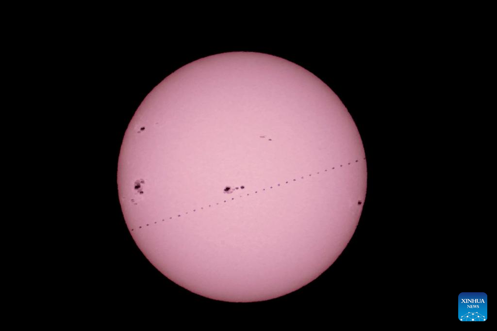 A stacked composite photo taken on Jan. 16, 2026 in China's capital Beijing shows the Chinese space station passing in front of the Sun. (Photo by Zhong Yi/Xinhua)